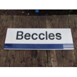 An aluminium Regional Railways station name sign "BECCLES" with Eastern Region blue underneath,