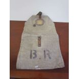 A double sided canvas bag with leather and brass plaques "STATION MANAGER LOWESTOFT" and "AREA