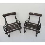 A pair of wrought iron and slatted wood platform chairs from Halesworth station