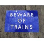 An enamel railway sign "BEWARE OF TRAINS"