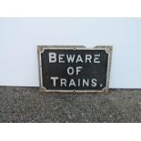 A cast iron railway sign "BEWARE OF TRAINS"