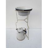 A white painted metal rail worker's wash stand with four B.R (E) enamelled wash bowls