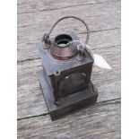 A railway signal lamp interior with reservoir and brass burner,