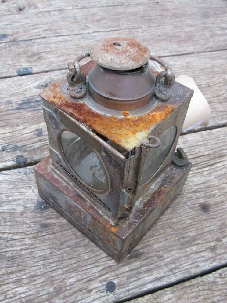 An LNER railway signal lamp interior with reservoir and burner,