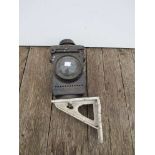 An LNER black painted signal lamp case on bracket and a cast iron lamp case finial stamped GER