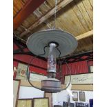 A railway signal box ceiling hanging oil lamp with reservoir,