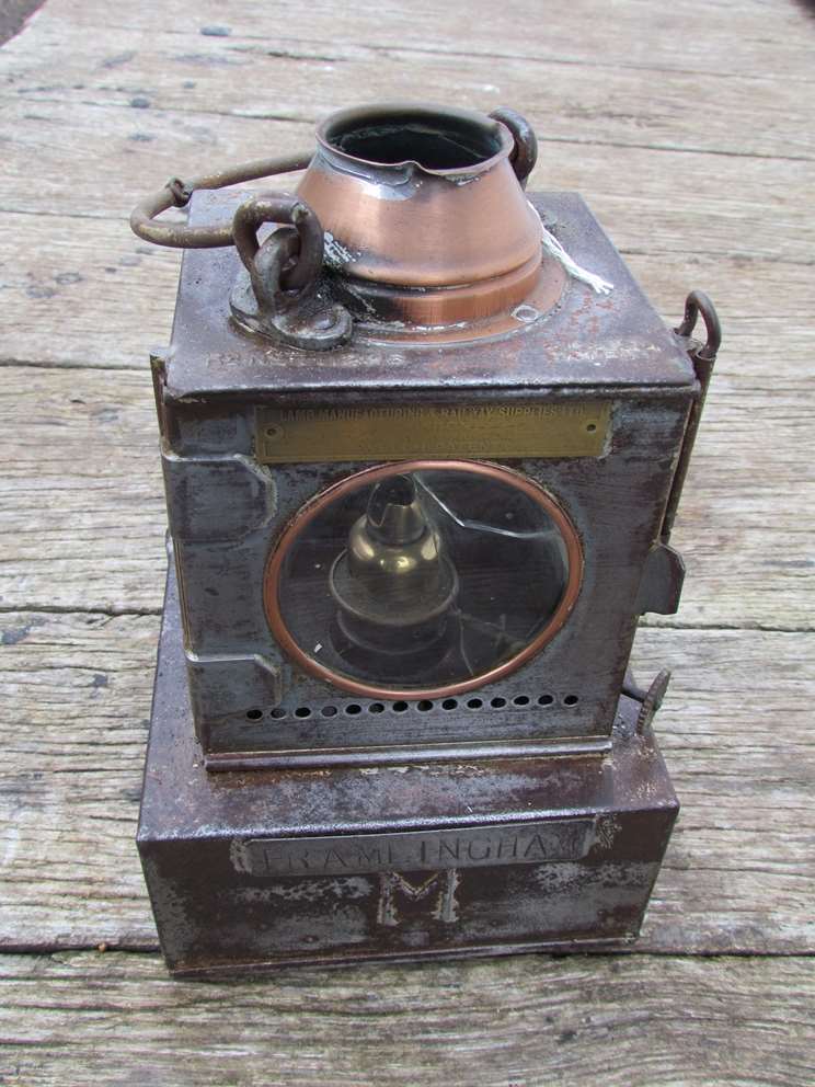 An LNER railway signal lamp interior with reservoir and brass burner stamped FRAMLINGHAM