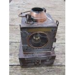 An LNER railway signal lamp interior with reservoir and brass burner stamped FRAMLINGHAM