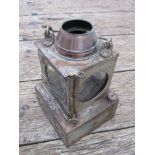 A railway signal lamp interior with reservoir and ceramic burner,