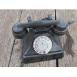 A black Bakelite railway station office desk telephone