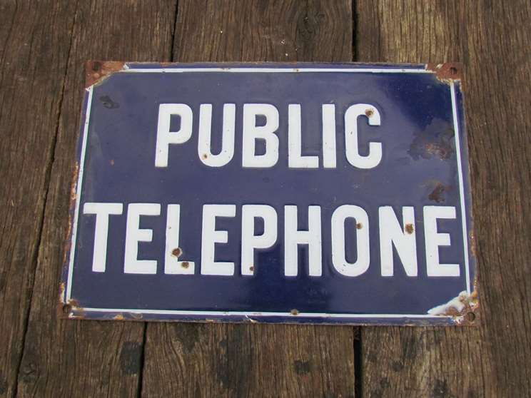 An enamelled "PUBLIC TELEPHONE" sign. 45.5 x 30cm