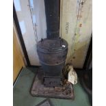 A Romesse cast iron signal box stove with chimney,