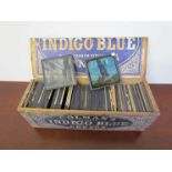 A Colemans Mustard box containing various magic lantern slides, some railway related