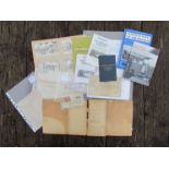 A box containing multiple items of paperwork, timetables, receipt books,
