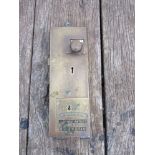 A brass penny in the slot public toilet door lock,