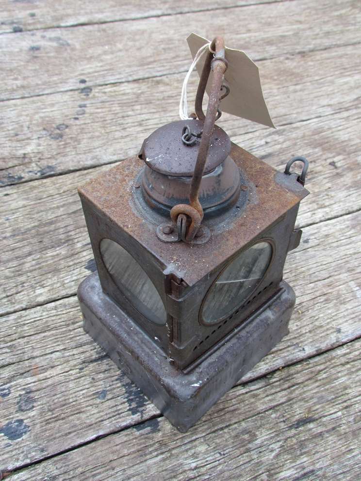 An LNER railway signal lamp interior with reservoir and brass burner