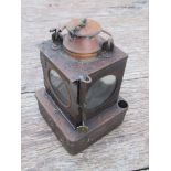 An LNER railway signal lamp interior with reservoir and brass burner