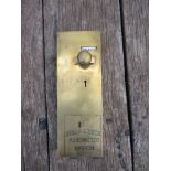 A brass penny in the slot public toilet door lock,