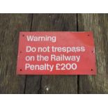An enamel railway notice sign "WARNING DO NOT TRESPASS ON THE RAILWAY PENALTY £200"