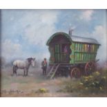 STEPHEN WALKER (1900-2004): An oil on canvas, green gypsy wagon with female at doorway,