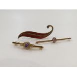 A 9ct gold brooch set with amethyst and diamond effect paste stones,