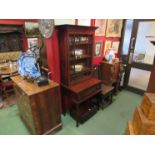 A late Victorian mahogany glazed top bookcase over single drawer base pull-out frieze