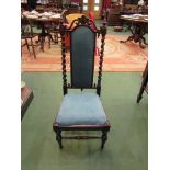 A William IV rosewood chair with carved decoration the turned finials over barley twist columns on