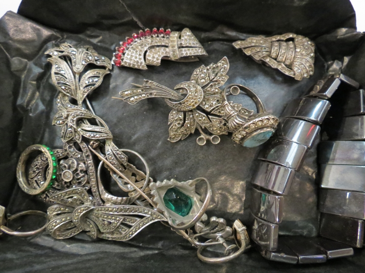 A box of vintage Art Deco jewellery, mostly silver, including silver and marcasite brooches,