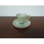 A 19th Century green jade tea cup and saucer,