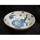 An 18th Century English Delft Dragon design slop bowl