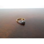 An 18ct gold and platinum solitaire diamond ring, 0.