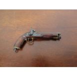 A miniature apprentice model of a 19th Century percussion pistol, 9.