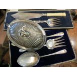 A small quantity of flatware including a small entree dish