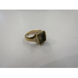 A gold ring set with citrine intaglio,