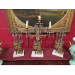 A 19th Century trio of French ormolu candlesticks