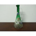 A late 19th Century faceted jug with slender neck with handpainted floral detail ,26cm tall,