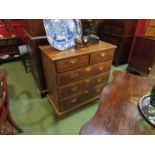 An early 18th Century walnut chest of two short over three long drawers on bracket feet,