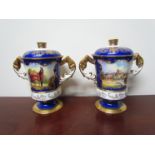 A pair of Aynsley covered urns with twin handles, circular foot, deep blue and gilt decoration,