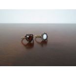 A heart shaped garnet ring and an oval opal and garnet ring (2)