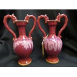 A pair of Chinese Langyao red glazed double dragon amphora vases,