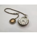 A silver fob watch with heavily detailed engraved case,