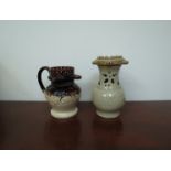 Two late 19th Century earthenware puzzle jugs,