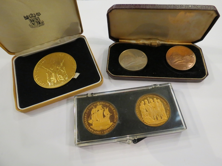 A cased proof set of UK coinage, cased commemorative medallions; Silver Jubilee, Pilgrim Fathers,