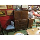 An 18th Century style cross banded figured walnut country house cabinet on chest,