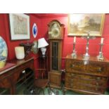 An early 20th Century oak long case clock with glazed panelled door,