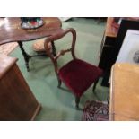 A set of six Victorian rosewood dining chairs, scrolled foliage back support,