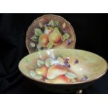 A Coalport cabinet plate and bowl, painted by Norman Lear and Rita Dale, pear detail,