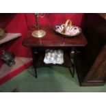 An Edwardian mahogany two tier lamp table with string inlaid decoration,