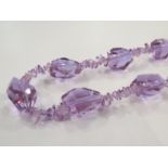 An amethyst coloured faceted glass necklace
