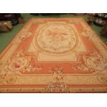 An Aubusson style rug tapestry, rose ground central floral sprays, cream borders,